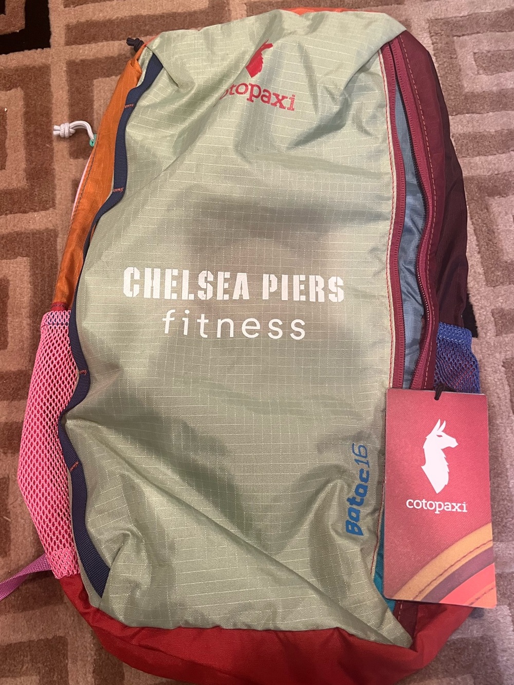 cotopaxi Chelsea Piers fitness pack in green, red, orange, pink - Picture 2 of 7